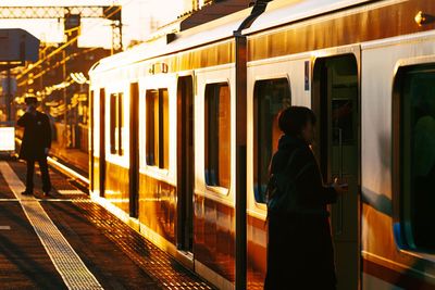 Man standing on railroad station