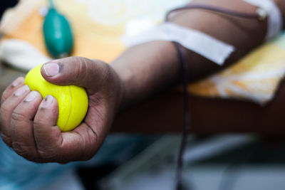 Close-up of hand holding ball