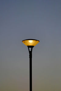 Low angle view of illuminated light against clear sky