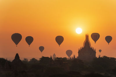 View of hot air balloons against sky during sunset