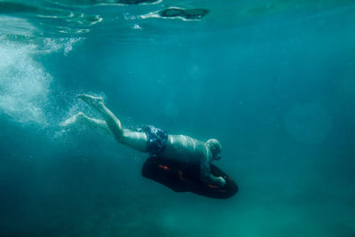 Man swimming in sea