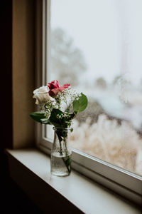 Flower vase on window sill