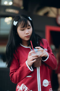 Girl drinking cold coffee outdoors