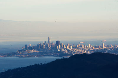 Modern buildings in city against sky