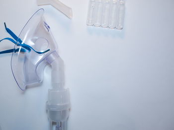 Close-up of eyeglasses on table against white background