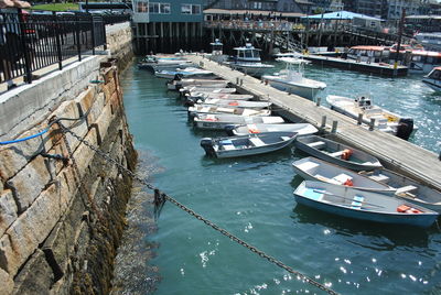 High angle view of boats moored at harbor