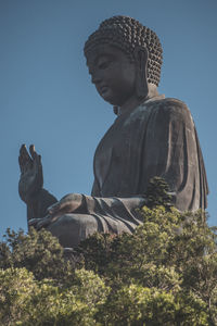 Low angle view of statue against sky