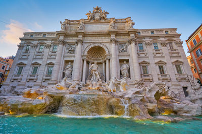 Trevi fountain and building against sky