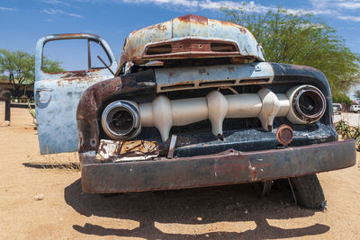 Abandoned vintage car on land