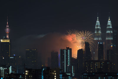 Low angle view of firework display at night