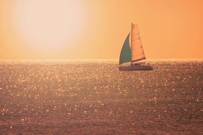 Lone sailboat in calm sea