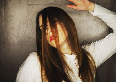 Close-up portrait of woman at home