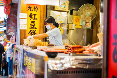 Man standing in store for sale at market