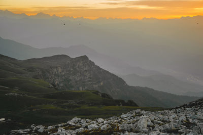 Scenic view of mountains against sky during sunset