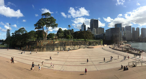 People in city against clear sky