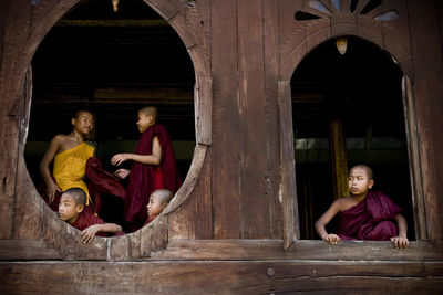 Woman standing in front of wooden door