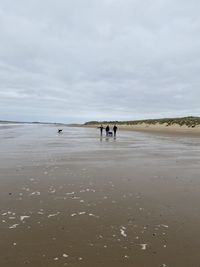 People walking on beach