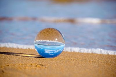 Close-up of crystal ball on table