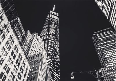 Low angle view of modern building at night