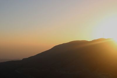 Scenic view of mountains against sky during sunset