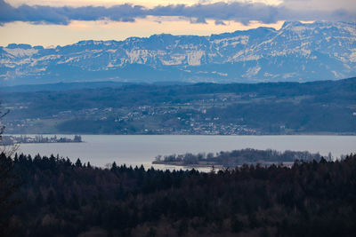 Scenic view of landscape and mountains against sky