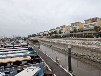 Boats moored at harbor