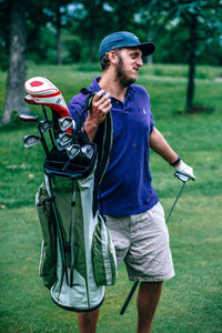 Full length of man standing on golf course