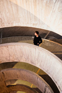 High angle view of man walking on staircase