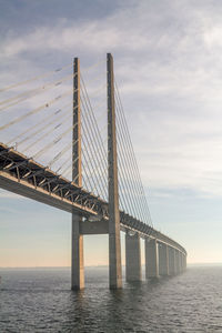 Bridge over sea against sky