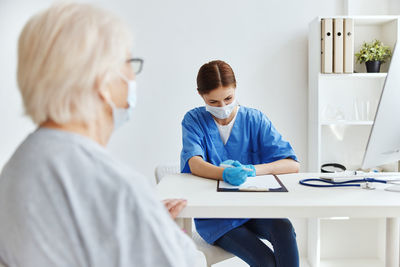 Woman sitting on table