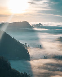 Scenic view of mountains against sky during sunset