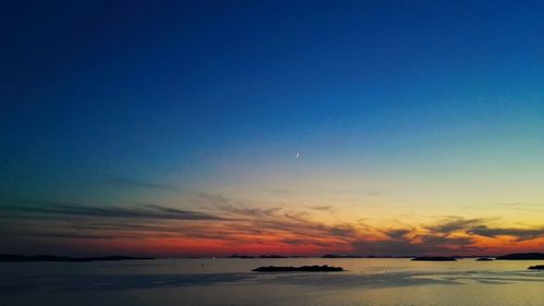 Scenic view of sea against sky at sunset