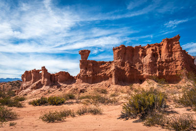 Rock formations on landscape against sky