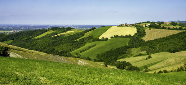 Scenic view of landscape and sea against sky