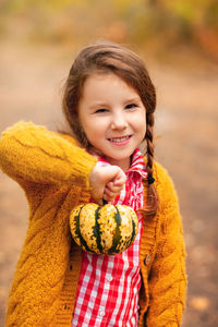 Portrait of smiling girl holding ice cream