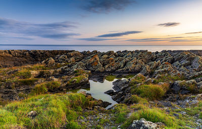 Scenic view of sea against sky during sunset