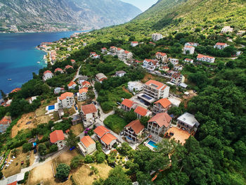 High angle view of townscape by mountain