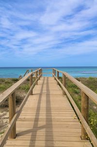 Pier over sea against sky