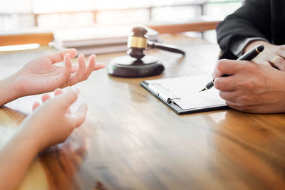 Close-up of man holding table