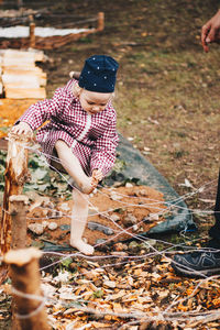 Full length of children on field