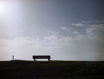 Empty bench on landscape