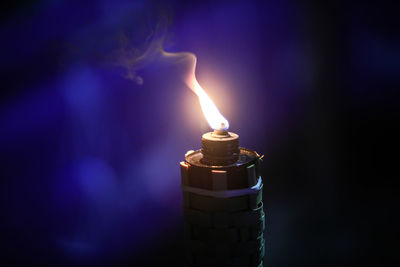 Close-up of burning candle