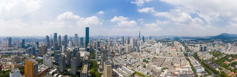 Aerial view of modern buildings in city against sky