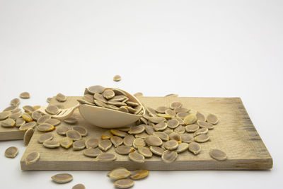 Close-up of cake on table against white background