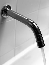 Close-up of faucet in bathroom