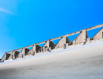 Low angle view of building against blue sky