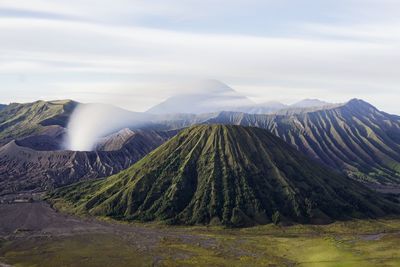 Steam coming out from volcanic mountain