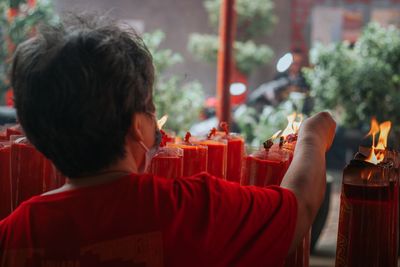 Side view of woman praying