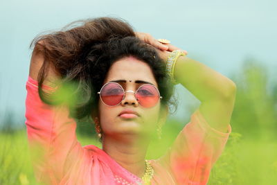 Portrait of young woman in sunglasses