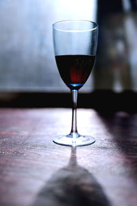 Close-up of wineglass on table